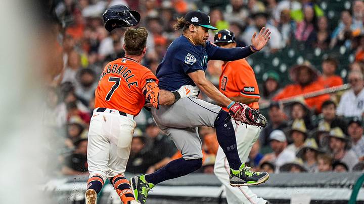 Detroit Tigers third baseman Kevin McGonigle (7) runs into Seattle Mariners first baseman Josh Naylor (12) at first base during the fifth inning at Comerica Park in Detroit on Friday, June 5, 2026. Detroit Tigers third baseman Kevin McGonigle (7) runs into Seattle Mariners first baseman Josh Naylor (12) at first base during the fifth inning at Comerica Park in Detroit on Friday, June 5, 2026.