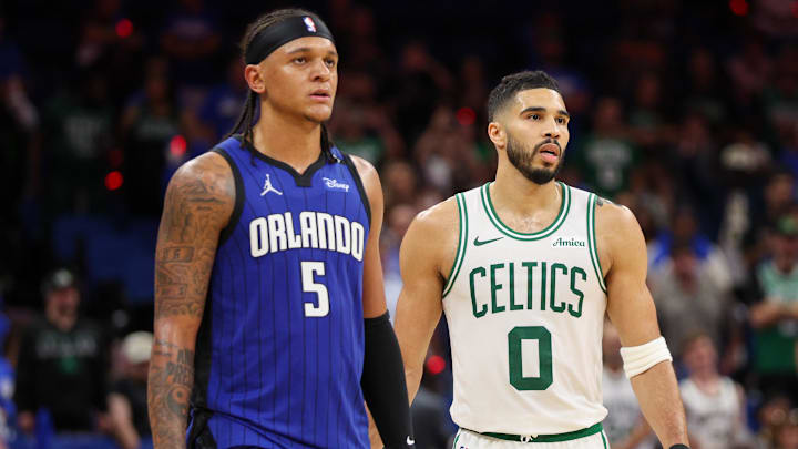 Apr 27, 2025; Orlando, Florida, USA; Orlando Magic forward Paolo Banchero (5) and Boston Celtics forward Jayson Tatum (0) wait fro a break in play in the fourth quarter during game four of first round for the 2025 NBA Playoffs at Kia Center. Mandatory Credit: Nathan Ray Seebeck-Imagn Images