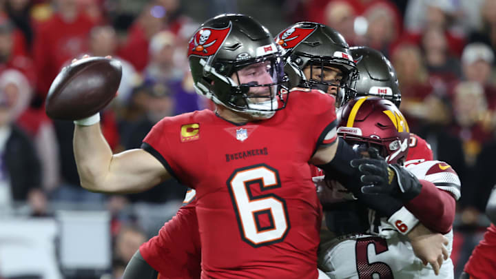 Jan 12, 2025; Tampa, Florida, USA; Tampa Bay Buccaneers quarterback Baker Mayfield (6) throws against Washington Commanders linebacker Dante Fowler Jr. (6) during the second quarter of a NFC wild card playoff at Raymond James Stadium. Mandatory Credit: Kim Klement Neitzel-Imagn Images