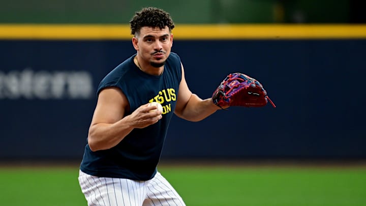Oct 2, 2024; Milwaukee, Wisconsin, USA; Milwaukee Brewers shortstop Willy Adames (27) warms up before game two of the Wildcard round for the 2024 MLB Playoffs against the New York Mets at American Family Field. Mandatory Credit: Benny Sieu-Imagn Images.