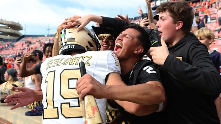 Nov 2, 2024; Auburn, Alabama, USA;  Vanderbilt Commodore fans celebrate with quarterback Blaze Berlowitz (19) after the Commodores beat the Auburn Tigers at Jordan-Hare Stadium. 