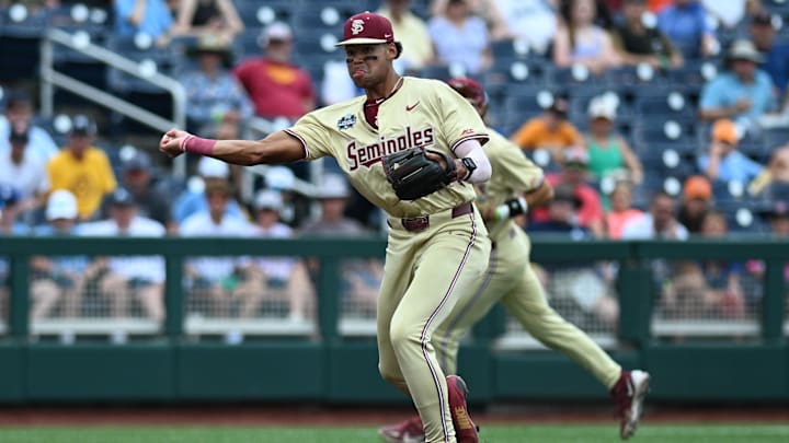 Jun 18, 2024; Omaha, NE, USA; Florida State Seminoles third baseman Cam Smith (24) throws to first base against the North Carolina Tar Heels during the first inning at Charles Schwab Field Omaha. Mandatory Credit: Steven Branscombe-Imagn Images