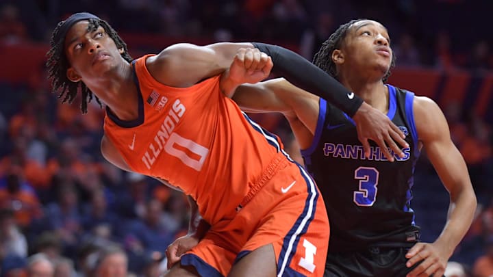 Nov 4, 2024; Champaign, Illinois, USA;  Illinois Fighting Illini forward Carey Booth (0) and Eastern Illinois Panthers guard Nakyel Shelton (3) battle for position during the second half at State Farm Center. Mandatory Credit: Ron Johnson-Imagn Images