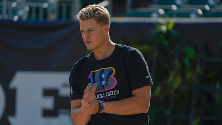Cincinnati Bengals quarterback Joe Burrow (9) rubs is wrist during warm-ups before the NFL Week 5 matchup against the Baltimore Ravens Sunday October 6, 2024 at Payor Stadium.