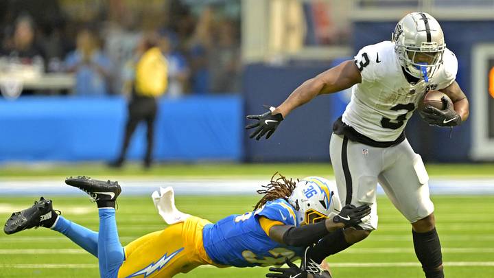 Sep 8, 2024; Inglewood, California, USA; Las Vegas Raiders running back Zamir White (3) is stopped by Los Angeles Chargers cornerback Ja'Sir Taylor (36) after a short gain in the second half at SoFi Stadium. Mandatory Credit: Jayne Kamin-Oncea-Imagn Images