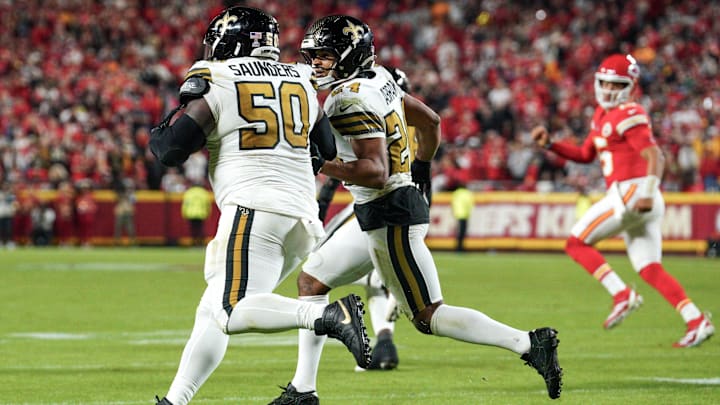 Oct 7, 2024; Kansas City, Missouri, USA; New Orleans Saints defensive tackle Khalen Saunders (50) runs the ball after his interception against the Kansas City Chiefs during the game at GEHA Field at Arrowhead Stadium. Mandatory Credit: Denny Medley-Imagn Images Oct 7, 2024; Kansas City, Missouri, USA; New Orleans Saints defensive tackle Khalen Saunders (50) runs the ball after his interception against the Kansas City Chiefs during the game at GEHA Field at Arrowhead Stadium. Mandatory Credit: Denny Medley-Imagn Images