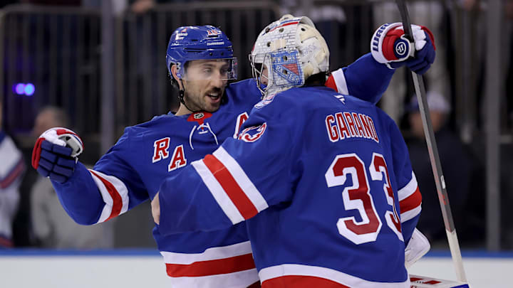 Mar 27, 2026; New York, New York, USA; New York Rangers goaltender Dylan Garand (33) is congratulated by center Vincent Trocheck (16) after his first career NHL win against the Chicago Blackhawks at Madison Square Garden. Mandatory Credit: Brad Penner-Imagn Images