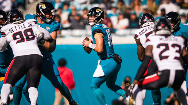 Dec 1, 2024; Jacksonville, Florida, USA; Jacksonville Jaguars quarterback Trevor Lawrence (16) drops back to pass against the Houston Texans in the first quarter at EverBank Stadium. Mandatory Credit: Jeremy Reper-Imagn Images