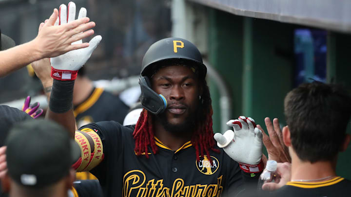 Aug 7, 2025; Pittsburgh, Pennsylvania, USA;  Pittsburgh Pirates center fielder Oneil Cruz (15) high-fives in the dugout after scoring a run against the Cincinnati Reds during the first inning at PNC Park. Mandatory Credit: Charles LeClaire-Imagn Images