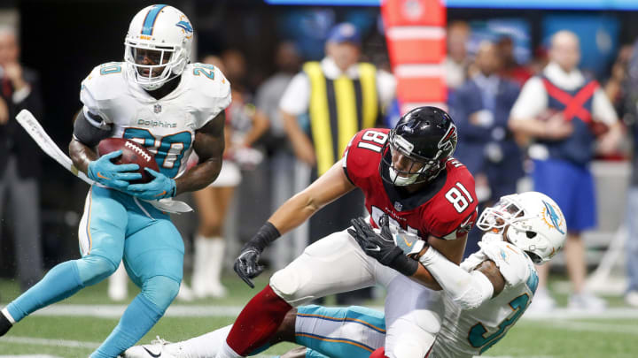 Miami Dolphins free safety Reshad Jones (20) intercepts a pass intended for Atlanta Falcons tight end Austin Hooper (81) to clinch a victory at Mercedes-Benz Stadium in 2017.