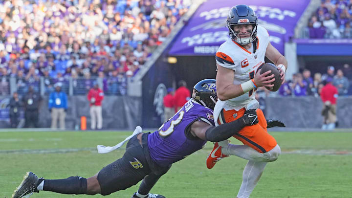 Nov 3, 2024; Baltimore, Maryland, USA; Denver Broncos quarterback Bo Nix (10) sacked during the fourth quarter by Baltimore Ravens linebacker Trenton Simpson (23) at M&T Bank Stadium. Mandatory Credit: Mitch Stringer-Imagn Images Nov 3, 2024; Baltimore, Maryland, USA; Denver Broncos quarterback Bo Nix (10) sacked during the fourth quarter by Baltimore Ravens linebacker Trenton Simpson (23) at M&T Bank Stadium. Mandatory Credit: Mitch Stringer-Imagn Images