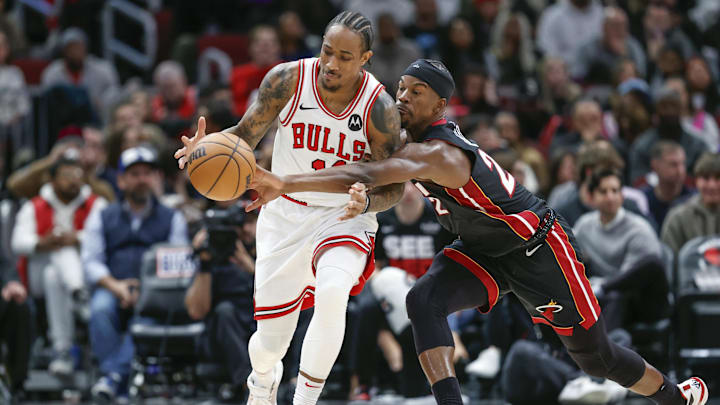Nov 20, 2023; Chicago, Illinois, USA; Miami Heat forward Jimmy Butler (22) defends against Chicago Bulls forward DeMar DeRozan (11) during the second half at United Center. Mandatory Credit: Kamil Krzaczynski-Imagn Images Nov 20, 2023; Chicago, Illinois, USA; Miami Heat forward Jimmy Butler (22) defends against Chicago Bulls forward DeMar DeRozan (11) during the second half at United Center. Mandatory Credit: Kamil Krzaczynski-Imagn Images