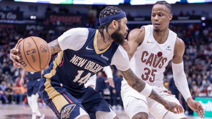 Mar 13, 2024; New Orleans, Louisiana, USA; New Orleans Pelicans forward Brandon Ingram (14) dribbles against Cleveland Cavaliers forward Isaac Okoro (35) during the second half at Smoothie King Center. Mar 13, 2024; New Orleans, Louisiana, USA; New Orleans Pelicans forward Brandon Ingram (14) dribbles against Cleveland Cavaliers forward Isaac Okoro (35) during the second half at Smoothie King Center.