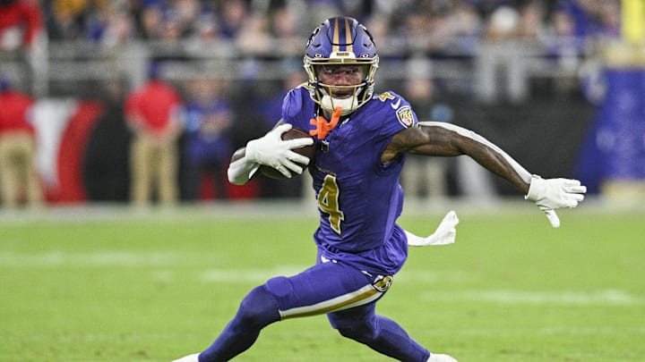 Nov 7, 2024; Baltimore, Maryland, USA; Baltimore Ravens wide receiver Zay Flowers (4) runs after a second quarter catch against the Cincinnati Bengals at M&T Bank Stadium. Mandatory Credit: Tommy Gilligan-Imagn Images