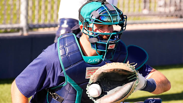 Feb 12, 2026; Phoenix, AZ, USA; Seattle Mariners catcher Cal Raleigh (29) works a drill at Seattle Mariners workouts in Peoria, Arizona. Mandatory Credit: Arianna Grainey-Imagn Images
