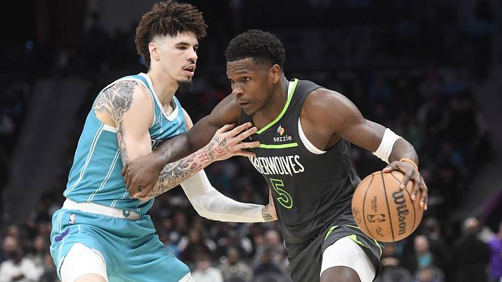 Mar 5, 2025; Charlotte, North Carolina, USA;  Minnesota Timberwolves guard Anthony Edwards (5) drives past Charlotte Hornets guard LaMelo Ball (1) during the second half at the Spectrum Center. 