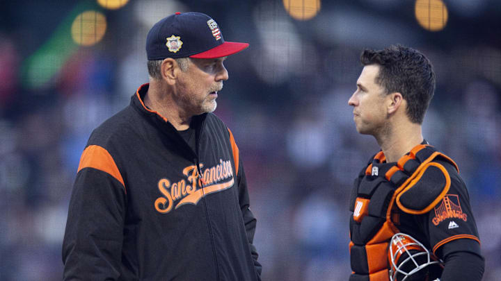 Jul 6, 2019; San Francisco, CA, USA; San Francisco Giants manager Bruce Bochy (15) and catcher Buster Posey meet after Madison Bumgarner had to leave the game in the second inning of a baseball game against the St. Louis Cardinals at Oracle Park. 
