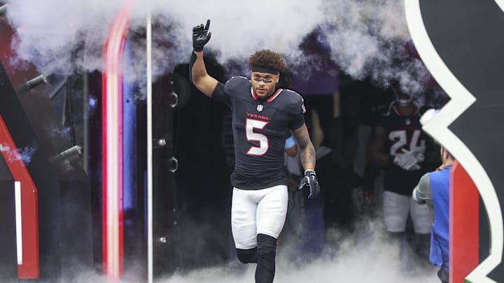 Oct 27, 2024; Houston, Texas, USA; Houston Texans safety Jalen Pitre (5) runs onto the field before the game against the Indianapolis Colts at NRG Stadium. Mandatory Credit: Troy Taormina-Imagn Images