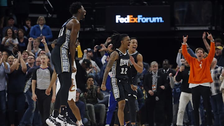 Jan 18, 2023; Memphis, Tennessee, USA; Memphis Grizzlies guard Ja Morant (12), guard Desmond Bane (22) and forward Jaren Jackson Jr. (13) react after defeating the Cleveland Cavaliers at FedExForum. Mandatory Credit: Petre Thomas-Imagn Images