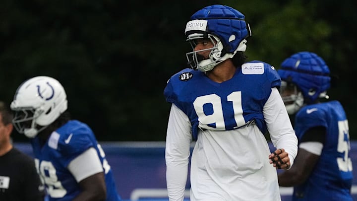 Indianapolis Colts defensive end JT Tuimoloau (91) walks up the field Thursday, July 31, 2025, during Colts Training Camp at Grand Park in Westfield.