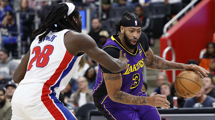 Nov 4, 2024; Detroit, Michigan, USA; Los Angeles Lakers forward Anthony Davis (3) dribbles defended by Detroit Pistons center Isaiah Stewart (28) in the first half at Little Caesars Arena. Mandatory Credit: Rick Osentoski-Imagn Images