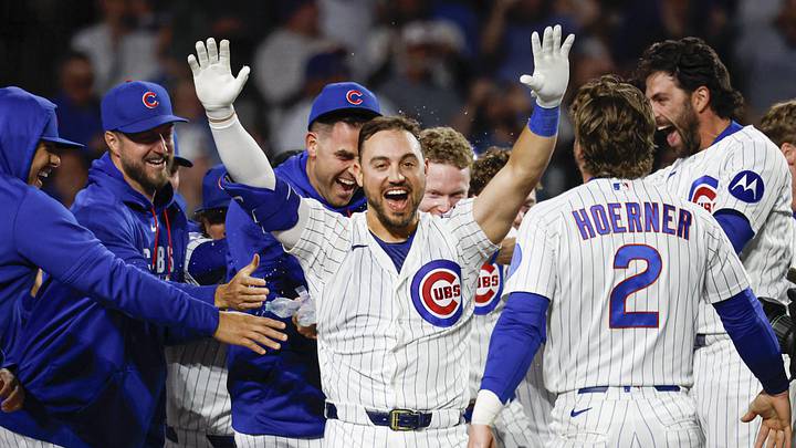 May 4, 2026; Chicago, Illinois, USA; Chicago Cubs right fielder Michael Conforto (20) celebrates with teammates after hitting a game winning solo home run against the Cincinnati Reds during the ninth inning at Wrigley Field. Mandatory Credit: Kamil Krzaczynski-Imagn Images