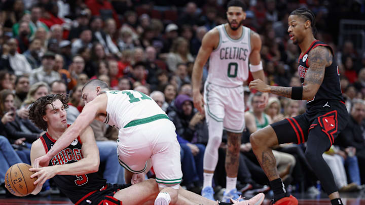 Nov 29, 2024; Chicago, Illinois, USA; Chicago Bulls guard Josh Giddey (3) battles for the ball with Boston Celtics guard Payton Pritchard (11) during the first half at United Center. Mandatory Credit: Kamil Krzaczynski-Imagn Images