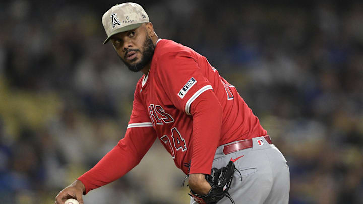 May 16, 2025; Los Angeles, California, USA; Los Angeles Angels relief pitcher Kenley Jansen (74) checks the runner at first in the ninth inning against the Los Angeles Dodgers at Dodger Stadium. Mandatory Credit: Jayne Kamin-Oncea-Imagn Images