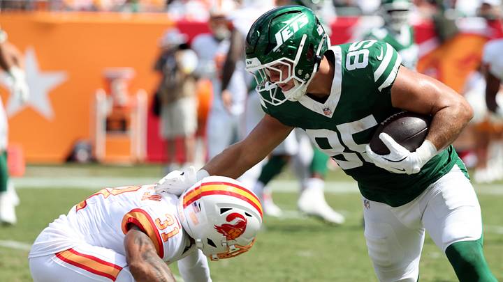 New York Jets tight end Mason Taylor (85) stiff arms as Tampa Bay Buccaneers safety Antoine Winfield Jr. (31) defends during the second quarter at Raymond James Stadium.