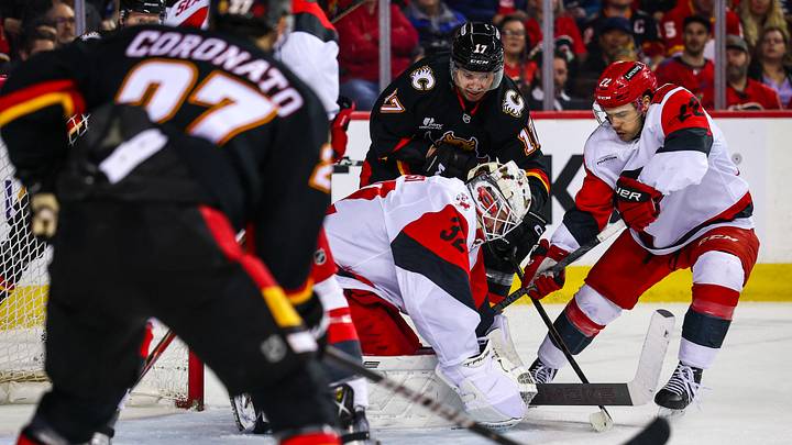 Mar 7, 2026; Calgary, Alberta, CAN; Carolina Hurricanes goaltender Brandon Bussi (32) makes a save against Calgary Flames center Yegor Sharangovich (17) during the second period at Scotiabank Saddledome. Mandatory Credit: Sergei Belski-Imagn Images Mar 7, 2026; Calgary, Alberta, CAN; Carolina Hurricanes goaltender Brandon Bussi (32) makes a save against Calgary Flames center Yegor Sharangovich (17) during the second period at Scotiabank Saddledome. Mandatory Credit: Sergei Belski-Imagn Images