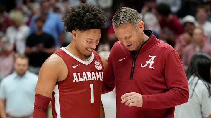 The University of Alabama unveiled the first banner honoring the school’s first Final Four appearance Friday, Oct. 11, 2024, in Coleman Coliseum. Alabama head coach Nate Oats presents a Final Four ring to Alabama guard Mark Sears (1).