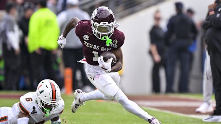 Dec 20, 2025; College Station, TX, USA; Texas A&M Aggies wide receiver Mario Craver (1) runs with the ball past Miami Hurricanes defensive back Xavier Lucas (6) during the game between the Aggies and the Hurricanes at Kyle Field. Mandatory Credit: Jerome Miron-Imagn Images Dec 20, 2025; College Station, TX, USA; Texas A&M Aggies wide receiver Mario Craver (1) runs with the ball past Miami Hurricanes defensive back Xavier Lucas (6) during the game between the Aggies and the Hurricanes at Kyle Field. Mandatory Credit: Jerome Miron-Imagn Images