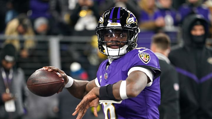 Jan 11, 2025; Baltimore, Maryland, USA; Baltimore Ravens quarterback Lamar Jackson (8) warms up before an AFC wild card game against the Pittsburgh Steelers at M&T Bank Stadium. Mandatory Credit: Mitch Stringer-Imagn Images
