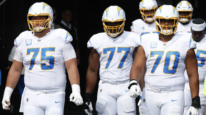 Los Angeles Chargers center Bradley Bozeman, guard Zion Johnson, and offensive tackle Rashawn Slater take the field against the Pittsburgh Steelers.