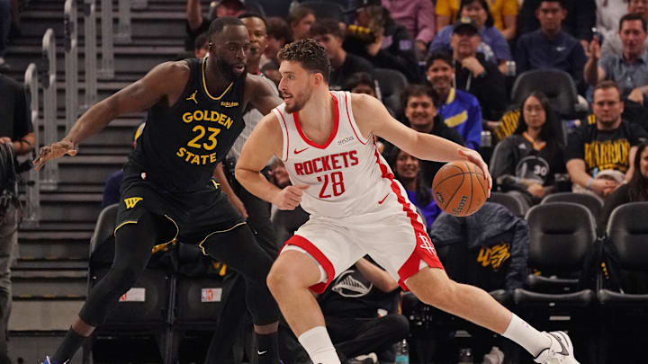 Nov 26, 2025; San Francisco, California, USA;  Houston Rockets center Alperen Sengun (28) drives against Golden State Warriors forward Draymond Green (23) in the second quarter at Chase Center. Mandatory Credit: David Gonzales-Imagn Images