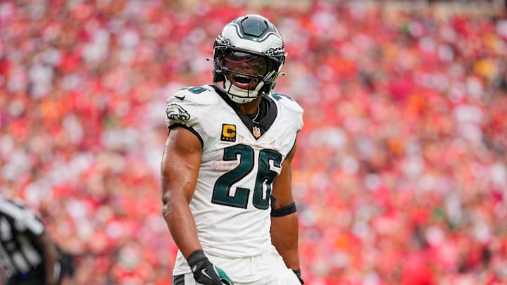 Sep 14, 2025; Kansas City, Missouri, USA; Philadelphia Eagles running back Saquon Barkley (26) celebrates after quarterback Jalen Hurts (not pictured) scored a touchdown  against the Kansas City Chiefs during the fourth quarter of the game at GEHA Field at Arrowhead Stadium. 