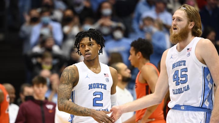 Jan 26, 2022; Chapel Hill, North Carolina, USA;  North Carolina Tar Heels guard Caleb Love (2) reacts with forward Brady Manek (45) in the second half at Dean E. Smith Center. Mandatory Credit: Bob Donnan-Imagn Images