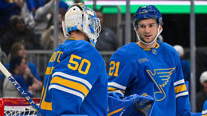 Oct 10, 2026; St. Louis, Missouri, USA; St. Louis Blues right wing Jimmy Snuggerud (21) celebrates with goaltender Jordan Binnington (50) after the Blues defeated the Columbus Blue Jackets at Enterprise Center. Mandatory Credit: Jeff Curry-Imagn Images