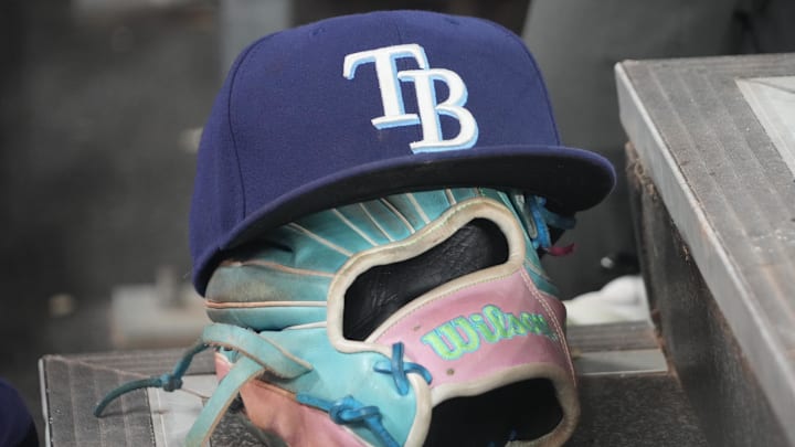 Sep 26, 2025; Toronto, Ontario, CAN; The hat and glove of Tampa Bay Rays third baseman Junior Caminero (13) in the dugout during the game against the Toronto Blue Jays at Rogers Centre. 