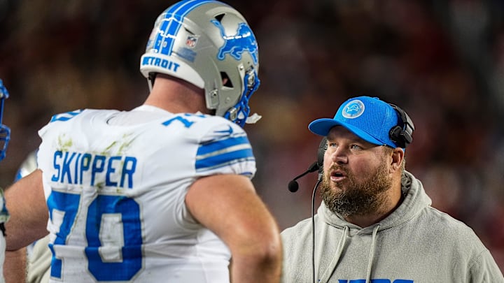 Detroit Lions offensive tackle Dan Skipper (70) talks to offensive line coach Hank Fraley during the second half against San Francisco 49ers at Levi's Stadium in Santa Clara, Calif. on Monday, Dec. 30, 2024.