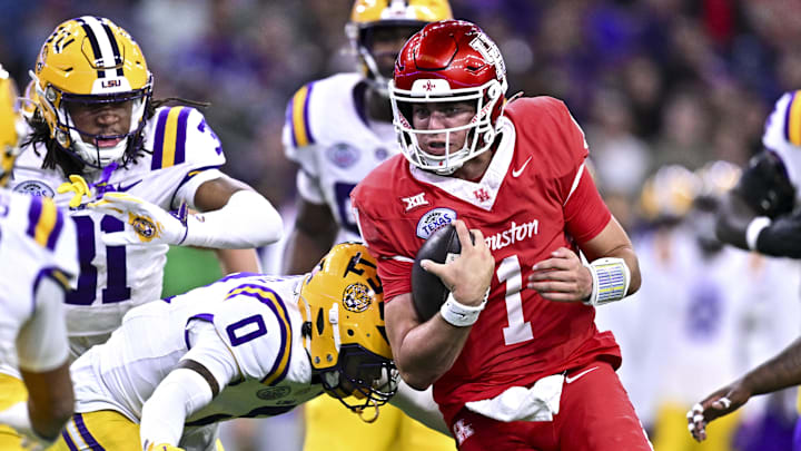 Houston Cougars quarterback Conner Weigman runs the ball during the first half against the Louisiana State Tigers at NRG Stadium. 