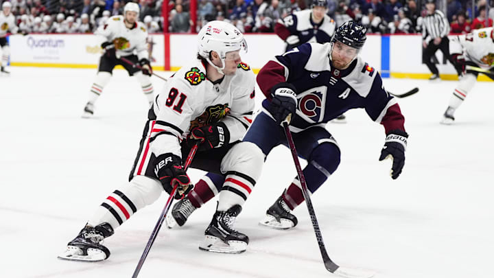 Mar 10, 2025; Denver, Colorado, USA; Colorado Avalanche defenseman Devon Toews (7) defends on Chicago Blackhawks center Frank Nazar (91) in the first period at Ball Arena. Mandatory Credit: Ron Chenoy-Imagn Images