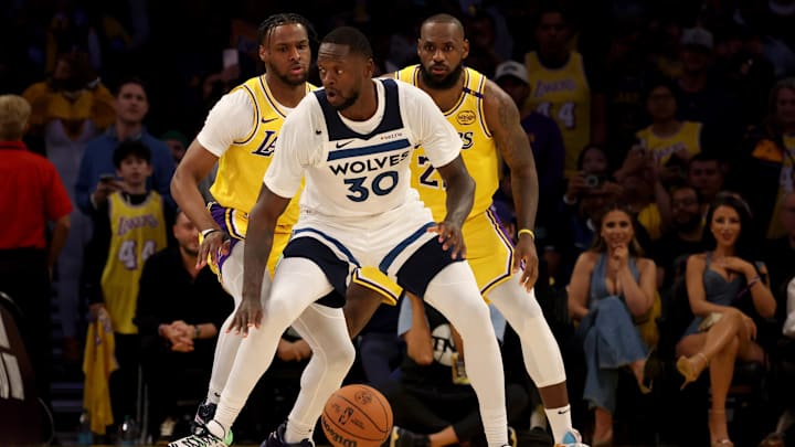 Los Angeles Lakers guard Bronny James, left, and forward LeBron James guard Minnesota Timberwolves forward Julius Randle during the second quarter against the Minnesota Timberwolves at Crypto.com Arena in Los Angeles on Oct. 22, 2024. Los Angeles Lakers guard Bronny James, left, and forward LeBron James guard Minnesota Timberwolves forward Julius Randle during the second quarter against the Minnesota Timberwolves at Crypto.com Arena in Los Angeles on Oct. 22, 2024.