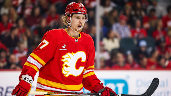 Mar 12, 2025; Calgary, Alberta, CAN; Calgary Flames center Connor Zary (47) skates against the Vancouver Canucks during the first period at Scotiabank Saddledome. Mandatory Credit: Sergei Belski-Imagn Images