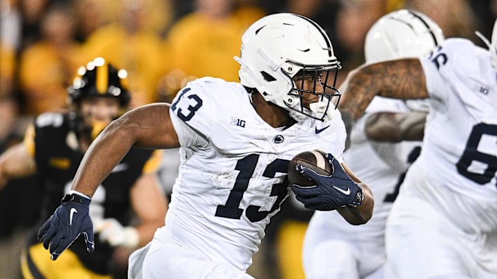 Penn State Nittany Lions running back Kaytron Allen (13) runs the ball against the Iowa Hawkeyes during the second quarter at Kinnick Stadium.