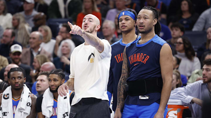 Dec 31, 2024; Oklahoma City, Oklahoma, USA; Oklahoma City Thunder guard Alex Caruso (9), forward Ousmane Dieng (13) and forward Jaylin Williams (6) watch as their team plays against the Minnesota Timberwolves during the second half at Paycom Center. Mandatory Credit: Alonzo Adams-Imagn Images