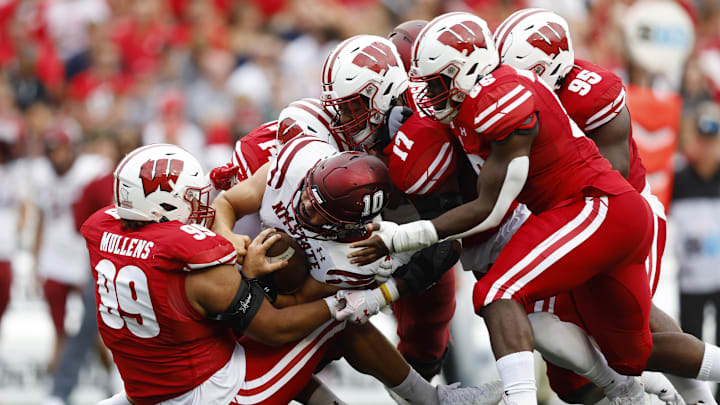 Sep 17, 2022; Madison, Wisconsin, USA;  New Mexico State Aggies quarterback Diego Pavia (10) is tackled during the second quarter against the Wisconsin Badgers at Camp Randall Stadium.