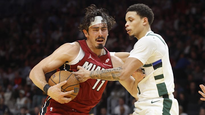 Nov 26, 2025; Miami, Florida, USA; Milwaukee Bucks guard Ryan Rollins (13) defends Miami Heat forward Jaime Jaquez Jr. (11) during the second half of an NBA Cup game at Kaseya Center. Mandatory Credit: Rhona Wise-Imagn Images