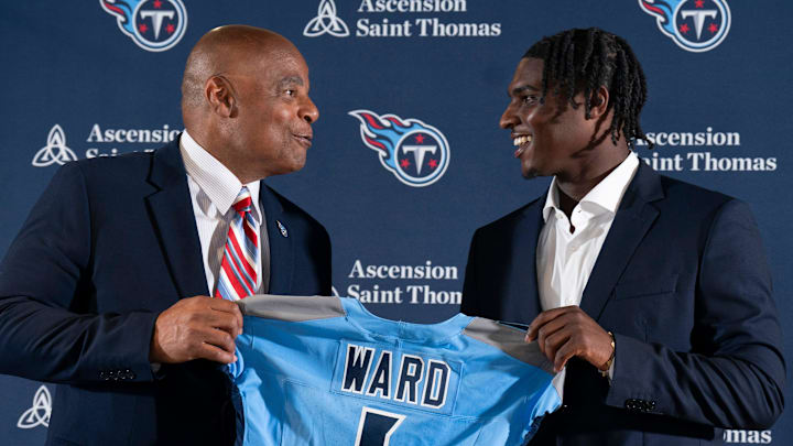 NFL Hall of Fame quarterback Warren Moon, left, poses for pictures with Cam Ward who earlier had been introduced as the Tennessee Titans first-round pick – and overall number one pick – in the NFL Draft at Ascension Saint Thomas Sports Park in Nashville, Tenn., Friday, April 25, 2025. Moon, whose No. 1 jersey is retired for the Tennessee Titans, allowed Ward to wear his number.
