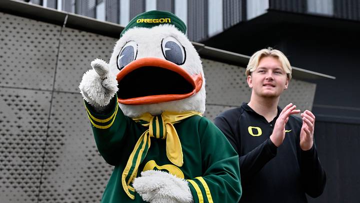 Oct 11, 2025; Eugene, Oregon, USA; Oregon Ducks mascot the Oregon Duck greets Oregon players as they arrive before the game against the Indiana Hoosiers at Autzen Stadium. Mandatory Credit: Troy Wayrynen-Imagn Images